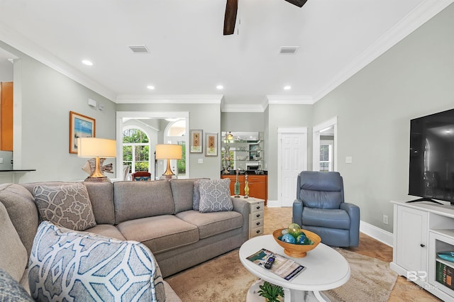 8954 Bay Point Dr, Elberta, AL 36530 - living area featuring ornamental molding, a ceiling fan, and visible vents