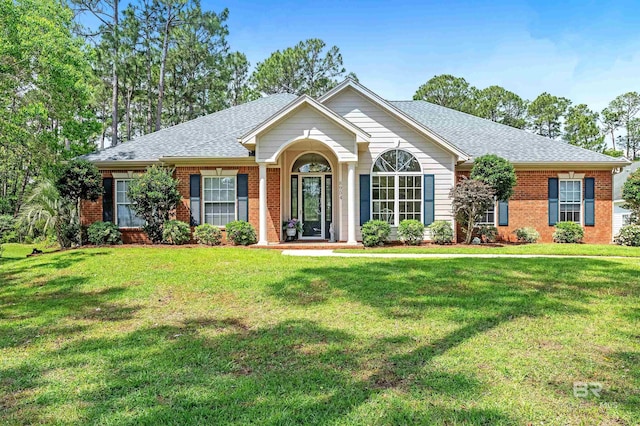8954 Bay Point Dr, Elberta, AL 36530 - ranch-style house featuring brick siding, roof with shingles, and a front lawn