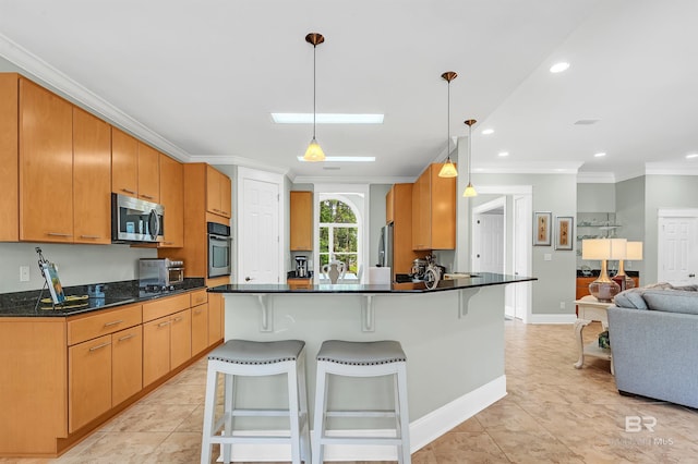 8954 Bay Point Dr, Elberta, AL 36530 - kitchen with ornamental molding, a breakfast bar, open floor plan, appliances with stainless steel finishes, and light tile patterned floors