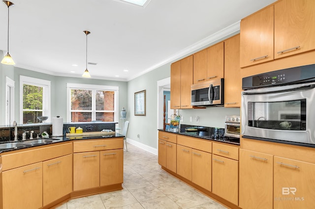 8954 Bay Point Dr, Elberta, AL 36530 - kitchen with a sink, appliances with stainless steel finishes, crown molding, and hanging light fixtures