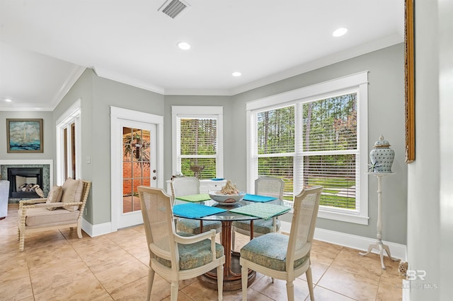 8954 Bay Point Dr, Elberta, AL 36530 - dining space featuring visible vents, baseboards, crown molding, and a wealth of natural light