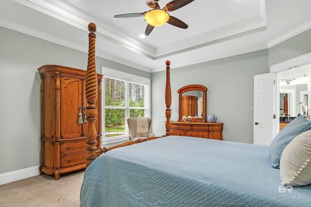 8954 Bay Point Dr, Elberta, AL 36530 - bedroom with ceiling fan, crown molding, baseboards, light carpet, and a tray ceiling