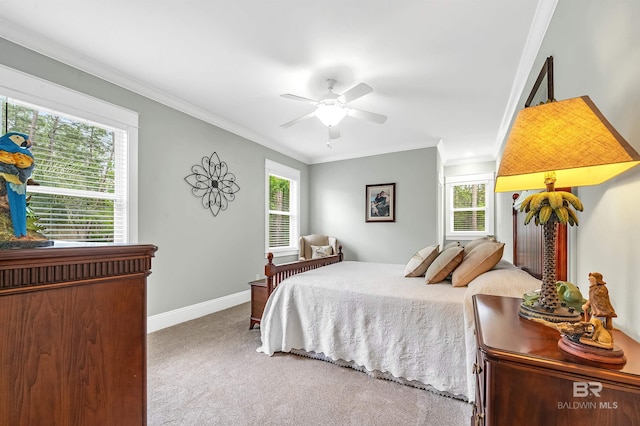 8954 Bay Point Dr, Elberta, AL 36530 - carpeted bedroom with crown molding, baseboards, and ceiling fan