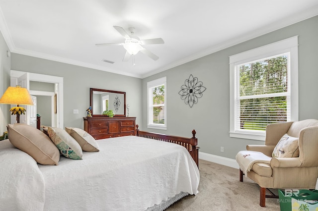 8954 Bay Point Dr, Elberta, AL 36530 - bedroom featuring crown molding, visible vents, light carpet, baseboards, and ceiling fan