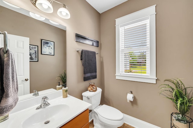 8954 Bay Point Dr, Elberta, AL 36530 - bathroom featuring vanity, baseboards, tile patterned floors, and toilet