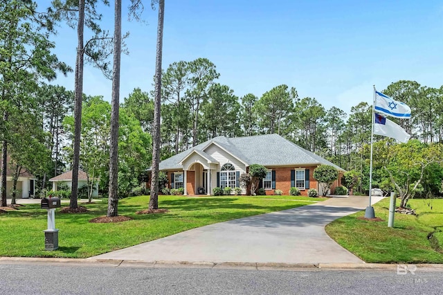 8954 Bay Point Dr, Elberta, AL 36530 - ranch-style home with brick siding, a front lawn, and concrete driveway