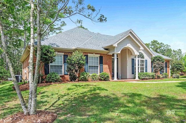 8954 Bay Point Dr, Elberta, AL 36530 - ranch-style home with brick siding, a shingled roof, and a front yard