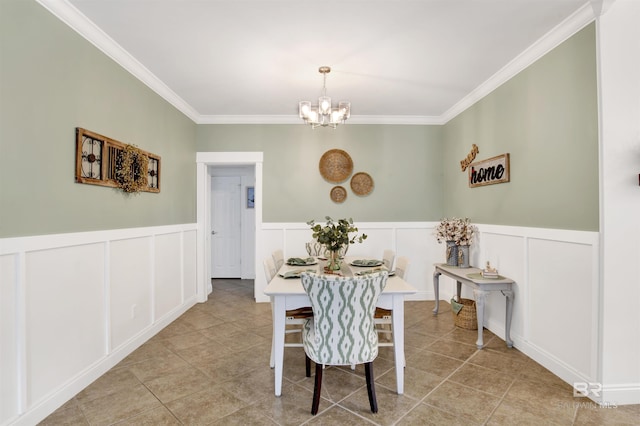 tiled dining room featuring a notable chandelier and ornamental molding