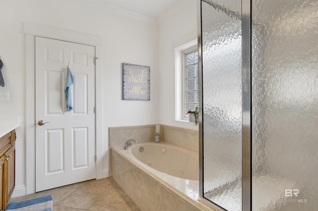 bathroom featuring crown molding, tile patterned floors, independent shower and bath, and vanity