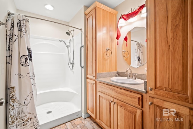 bathroom featuring vanity and walk in shower