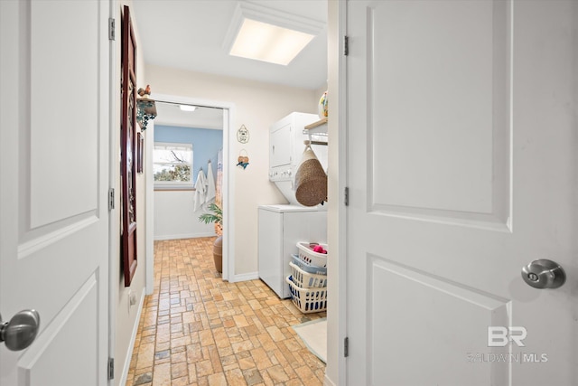 laundry area with stacked washer / dryer