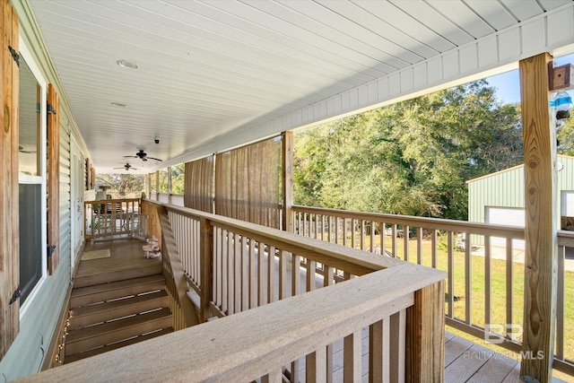 deck with a porch and ceiling fan