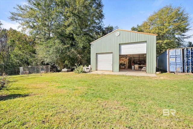 garage featuring a lawn