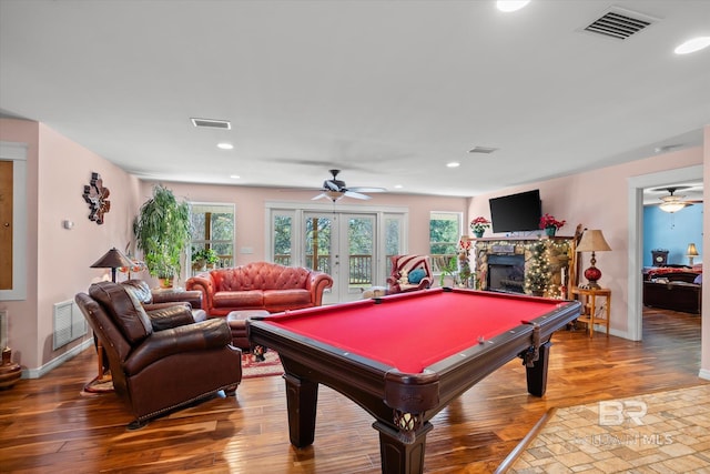 game room with ceiling fan, french doors, wood-type flooring, and billiards