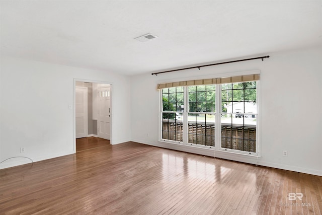 empty room featuring hardwood / wood-style flooring