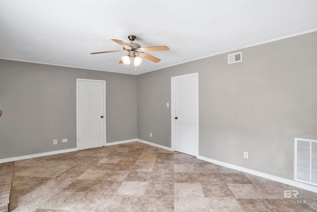 spare room with ceiling fan, light tile floors, and ornamental molding