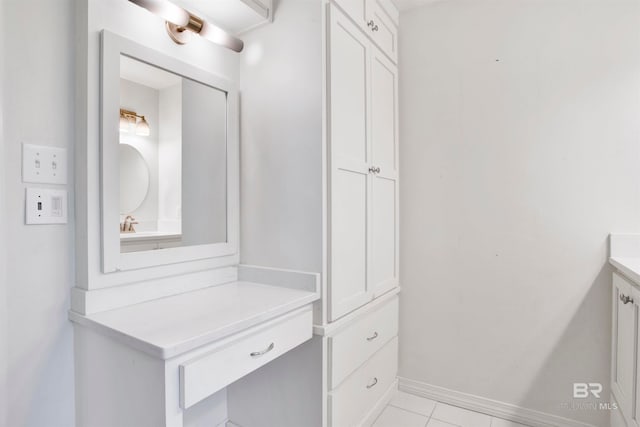 bathroom featuring tile flooring and vanity