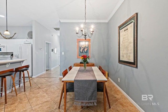 tiled dining area featuring an inviting chandelier and crown molding