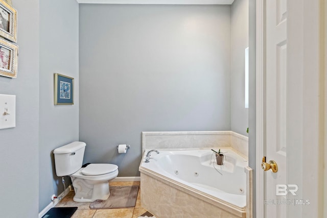 bathroom featuring a tub to relax in, tile patterned floors, and toilet