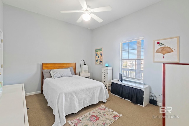 bedroom with light carpet and ceiling fan