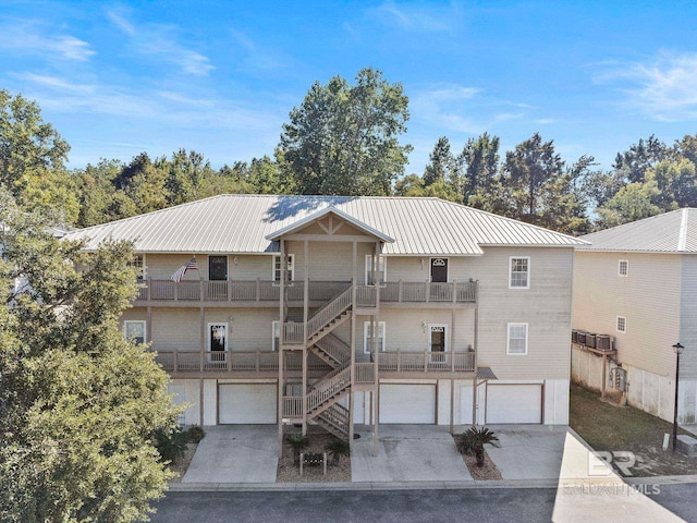 view of front of property with a balcony and a garage