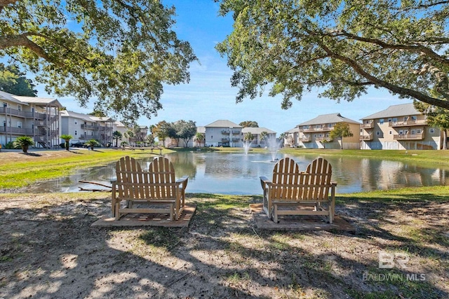 surrounding community with a water view