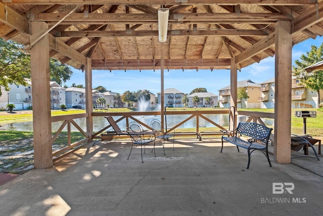 view of patio / terrace featuring a gazebo and a water view