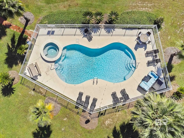 view of swimming pool with a yard and a patio area