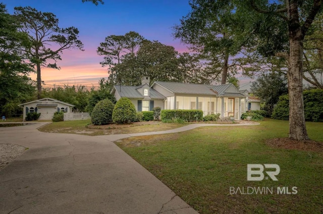 single story home with a yard and a garage