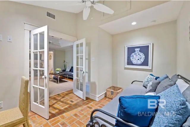 interior space featuring ceiling fan and french doors