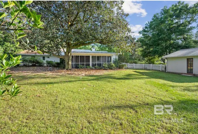 view of yard featuring a sunroom