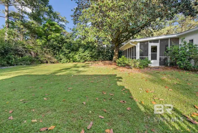 view of yard with a sunroom