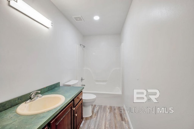 31246 Shambo Rd, Spanish Fort, AL 36527 - bathroom featuring wood finished floors, vanity, and shower / tub combination