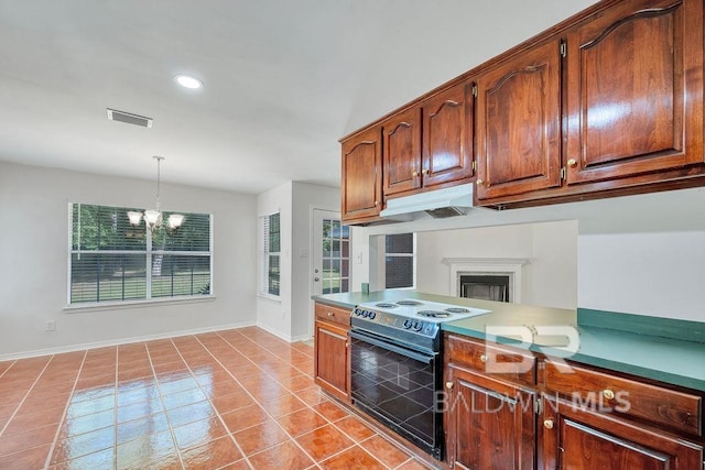 31246 Shambo Rd, Spanish Fort, AL 36527 - kitchen featuring electric range, a chandelier, light tile patterned flooring, under cabinet range hood, and recessed lighting