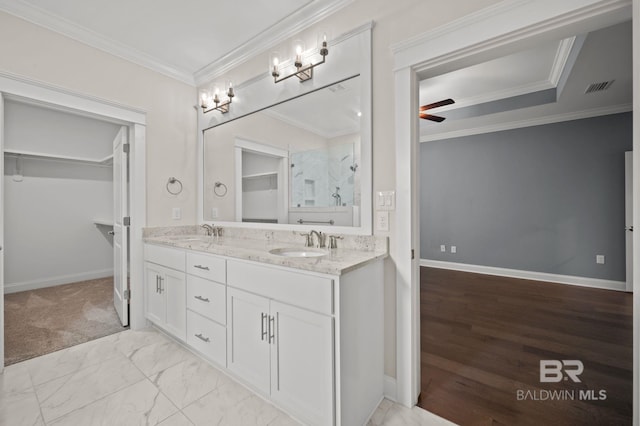 full bath with double vanity, baseboards, visible vents, and a sink