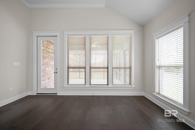 unfurnished room with baseboards, dark wood finished floors, and lofted ceiling
