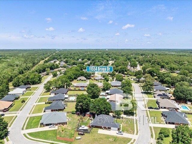 11554 Braga Dr, Daphne, AL 36526 - aerial perspective of suburban area with a heavily wooded area
