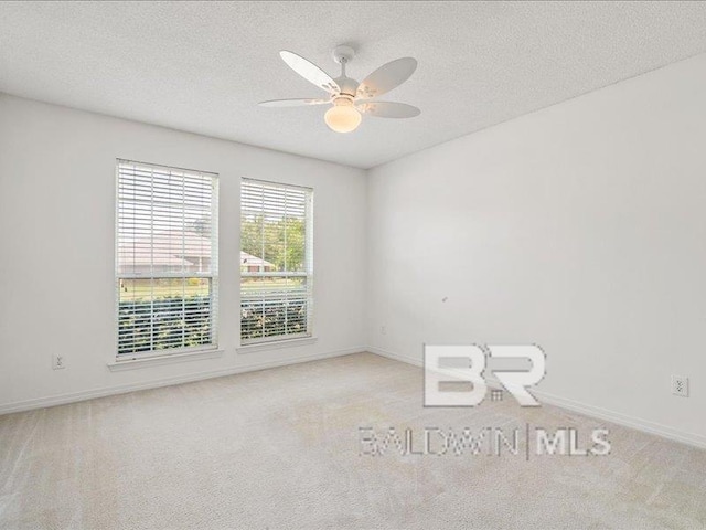 11554 Braga Dr, Daphne, AL 36526 - carpeted spare room with ceiling fan, a textured ceiling, and baseboards