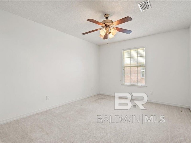 11554 Braga Dr, Daphne, AL 36526 - unfurnished room featuring a ceiling fan, carpet flooring, baseboards, and a textured ceiling