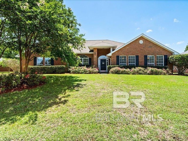 11554 Braga Dr, Daphne, AL 36526 - view of front of house with a front yard and brick siding