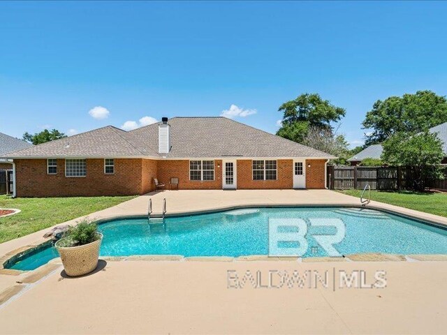 11554 Braga Dr, Daphne, AL 36526 - view of swimming pool featuring a patio