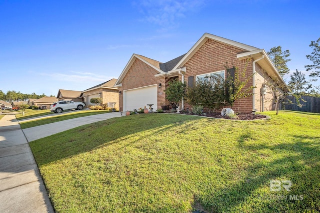 view of front of home featuring a garage and a front lawn