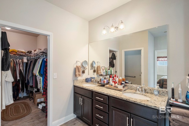 bathroom featuring vanity and hardwood / wood-style floors