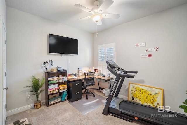 exercise room with carpet flooring and ceiling fan