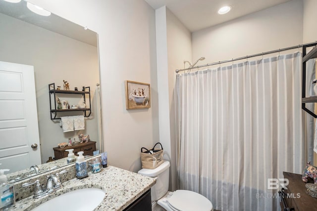 bathroom featuring vanity, a shower with curtain, and toilet