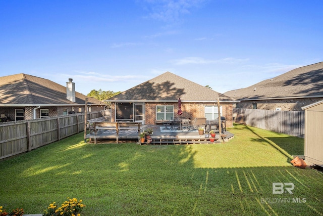 rear view of property with a patio area, a deck, and a lawn