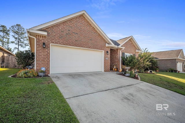 view of front of home with a front yard and a garage