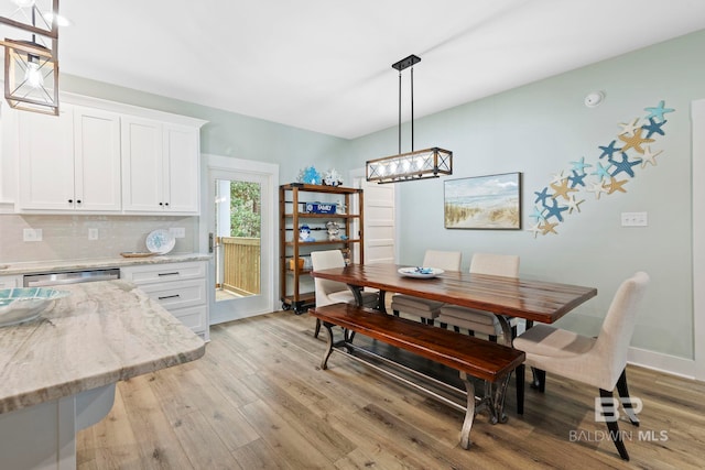 dining space with light hardwood / wood-style flooring