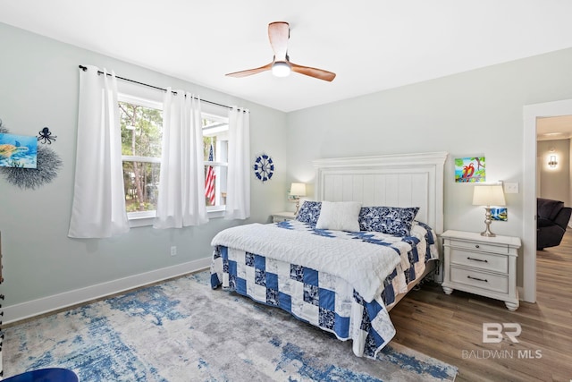 bedroom featuring dark hardwood / wood-style flooring and ceiling fan