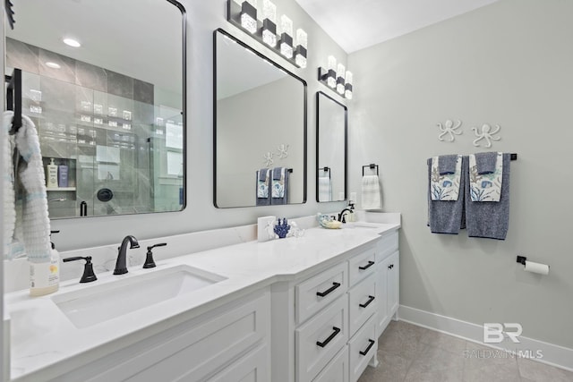 bathroom featuring vanity, a shower with shower door, and tile patterned floors